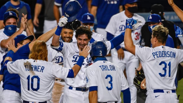 Aug 22, 2020; Los Angeles, California, USA; Los Angeles Dodgers first basemen Cody Bellinger (35) celebrates hitting a walkout home run to beat the Colorado Rockies 4-3 at Dodger Stadium. Mandatory Credit: Robert Hanashiro-USA TODAY Sports